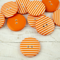 Plastový knoflík proužkovaný velký - oranžový