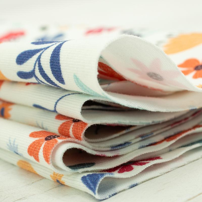 KOLOROWE KWIATKI / waniliowy - single jersey z elastanem TE210