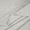 Bledě šedý melanž - prošívaný úplet