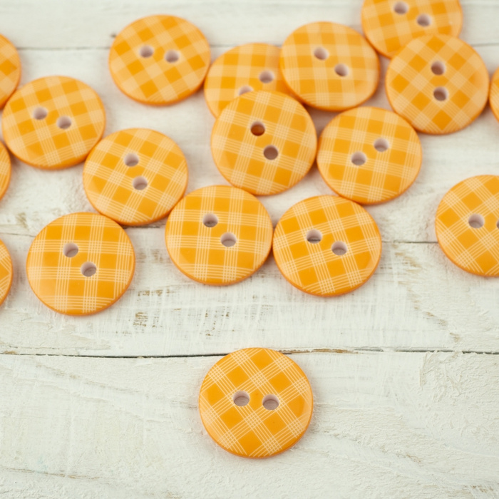 Kunststoffknopf mit Karomuster mittelgroß - lachs