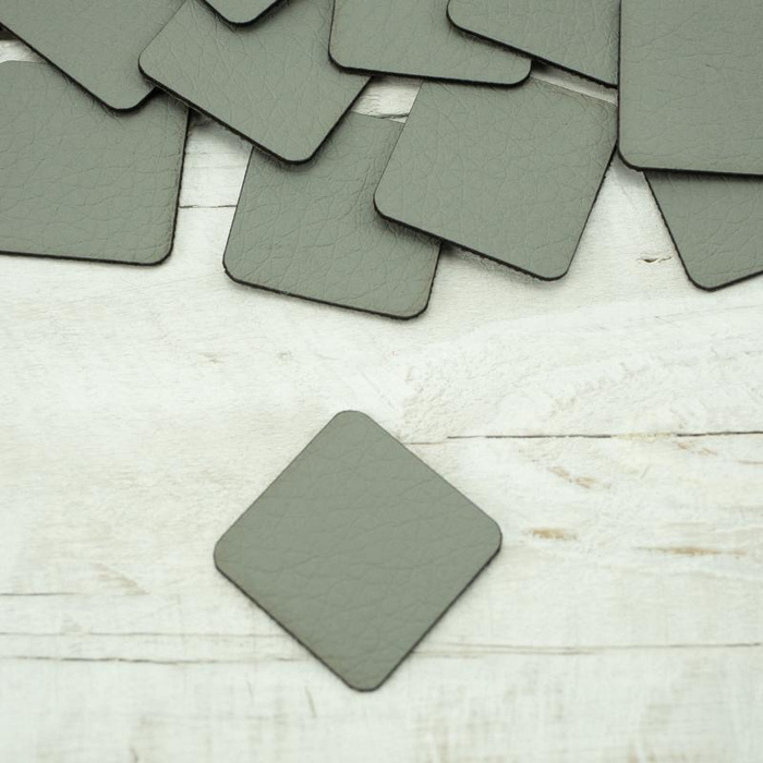 Pads under the eyelets Leatherette label small square - grey