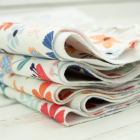 KOLOROWE KWIATKI / waniliowy - dresówka pętelkowa 